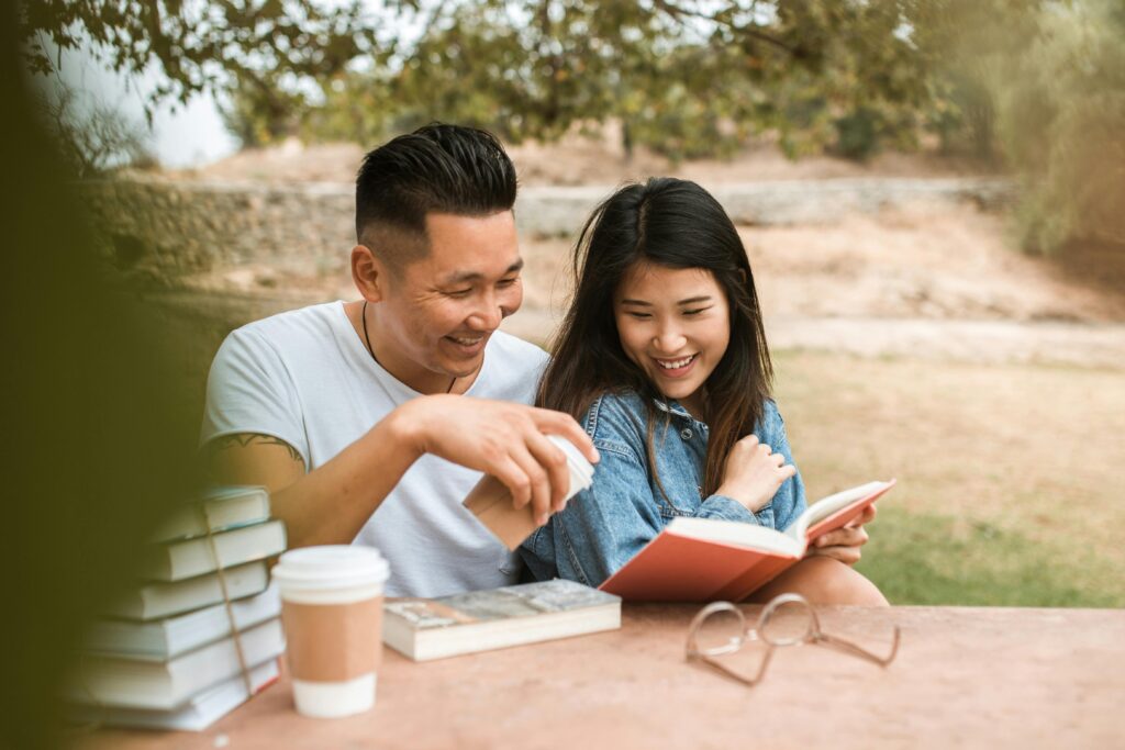 happiness happy smile couple coffee table book outdoors positivity